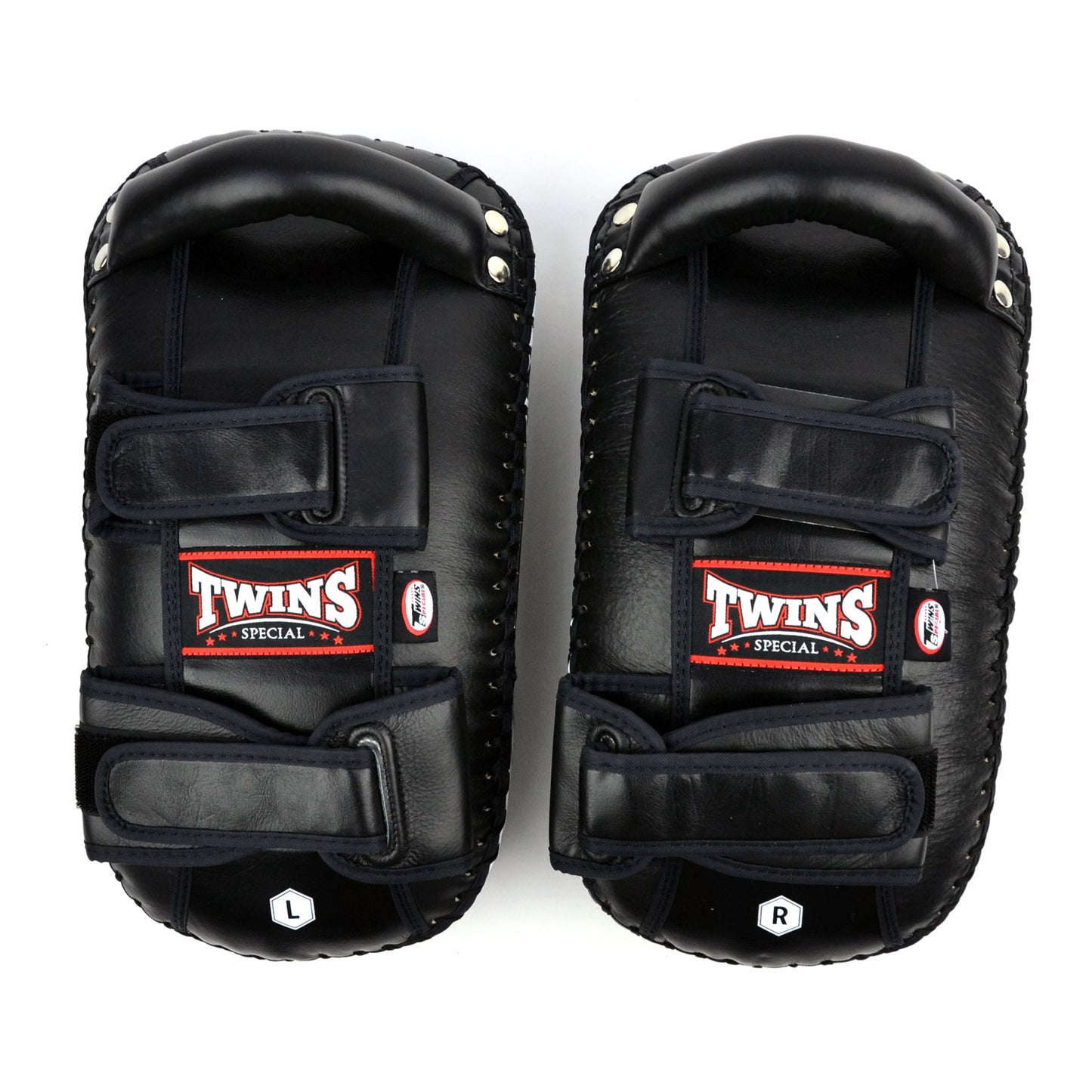 Black kick pads with Twins Special logo on a white background