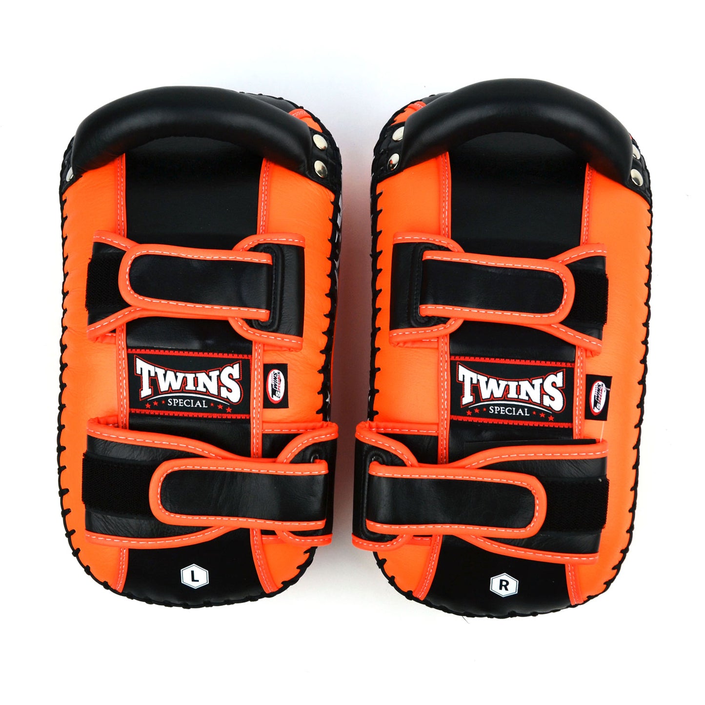 Orange kick pads with Twins Special logo on a white background