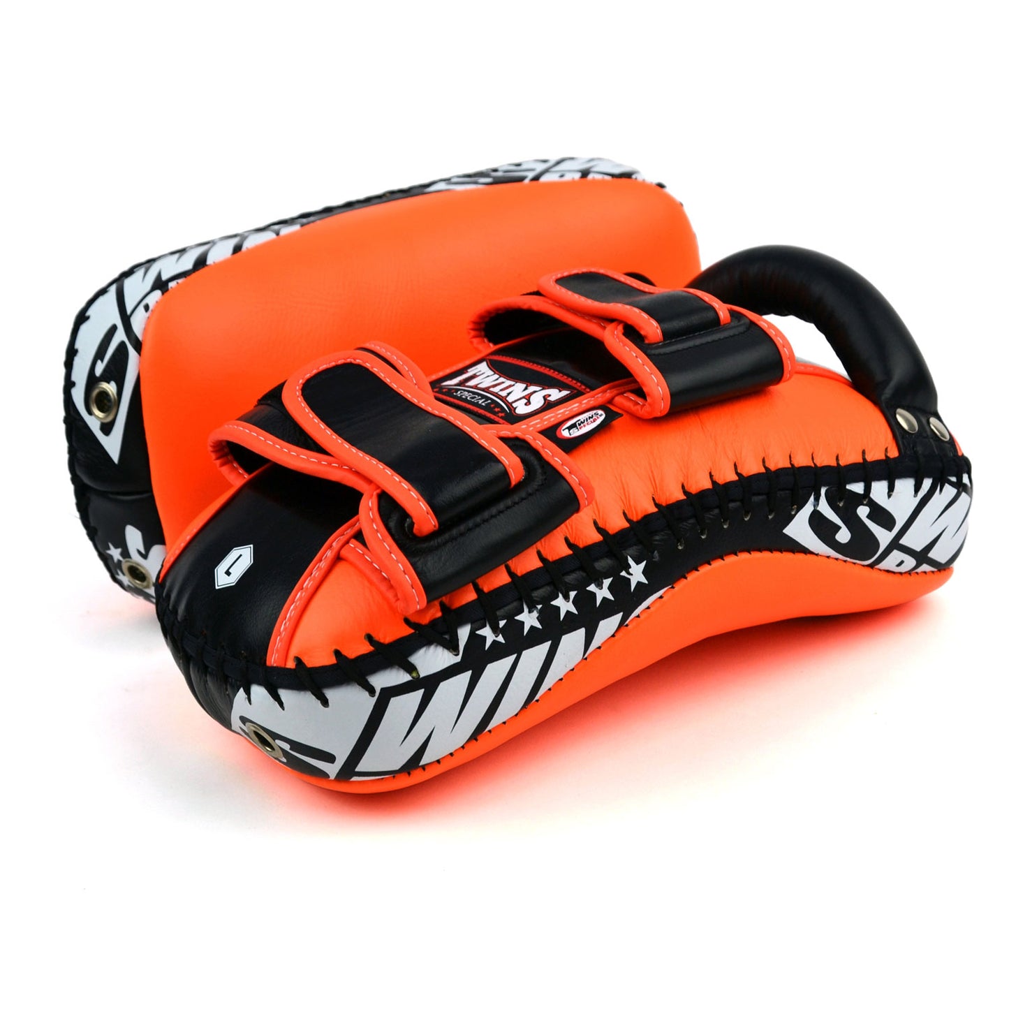 Orange kick pads with Twins Special logo on a white background