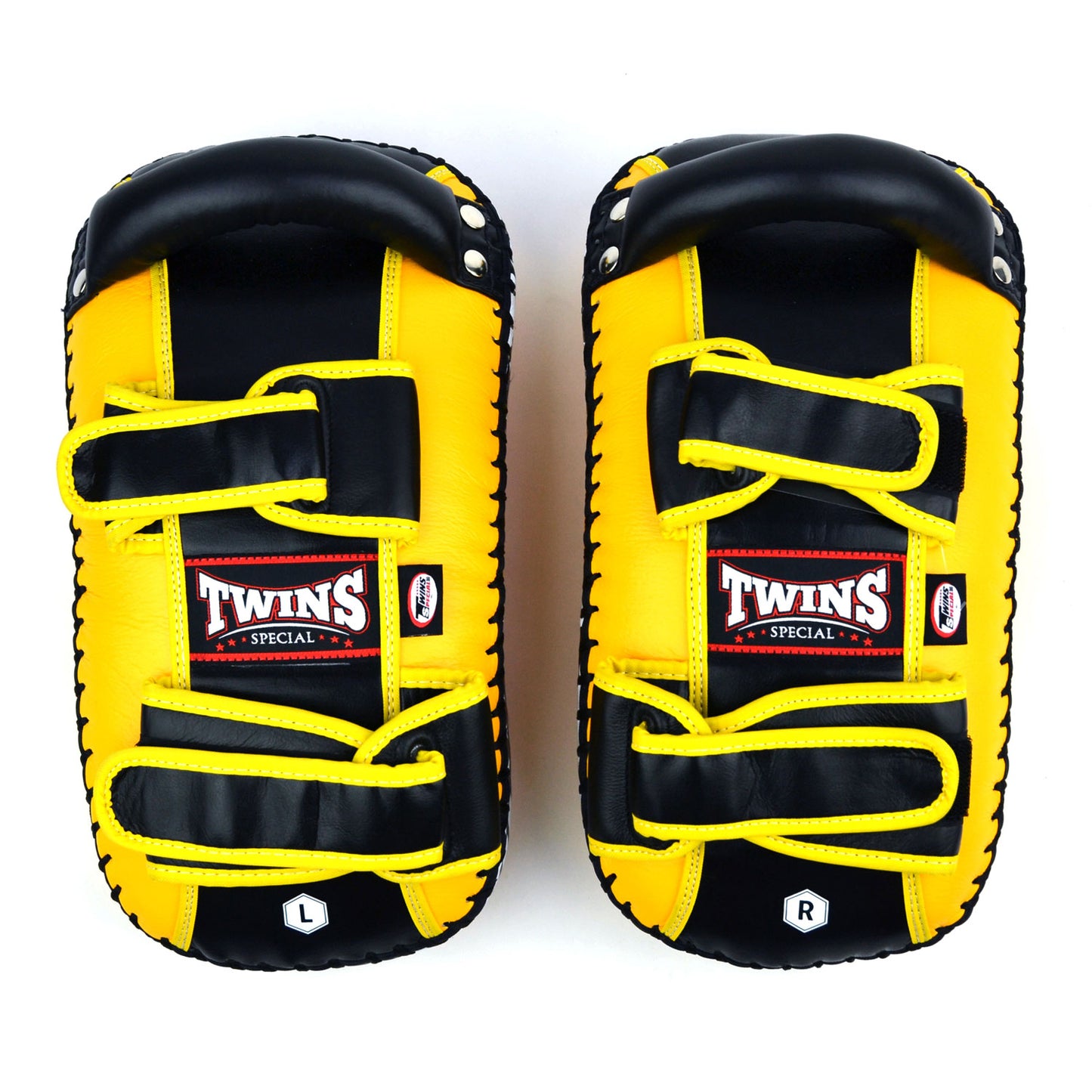Yellow kick pads with Twins Special logo on a white background