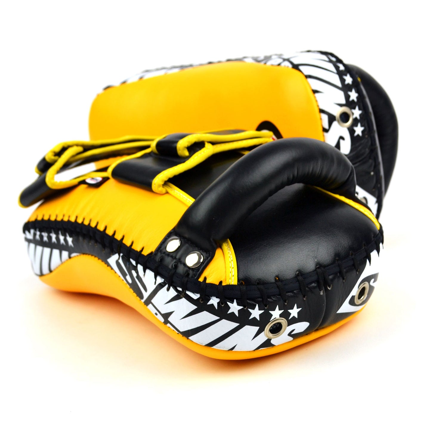Yellow kick pads with Twins Special logo on a white background