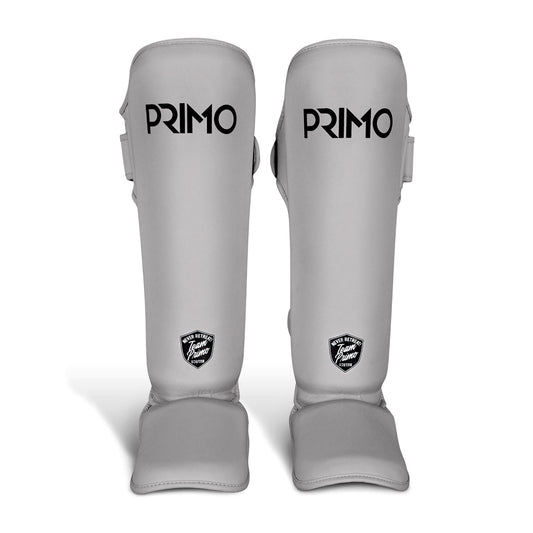 Pair of gray PRIMO shin guards on a white background
