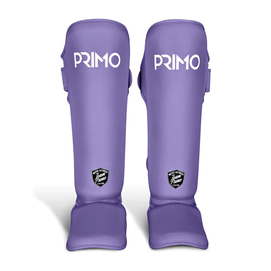 Purple Primo shin guards on a white background