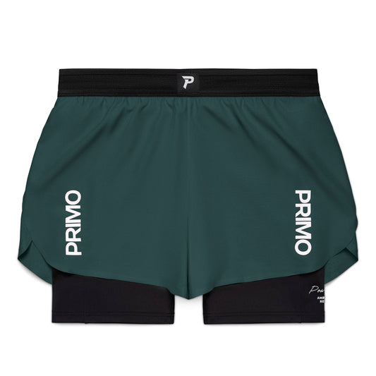 Green athletic shorts with 'Primo' branding on a white background