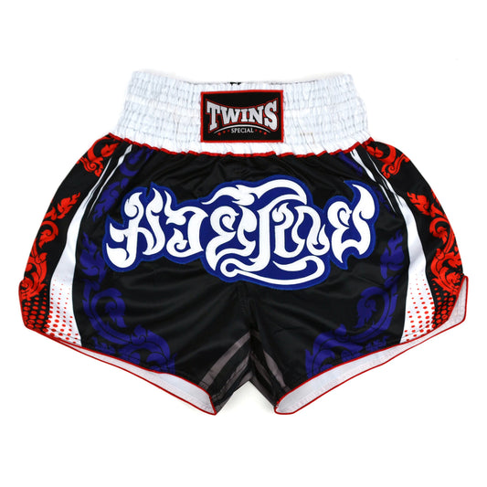 Black boxing shorts with red and blue designs and Twins Special logo on a white background