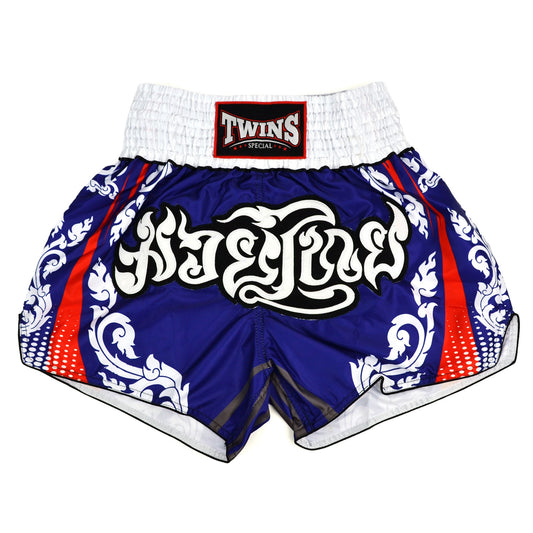 Blue and white Muay Thai shorts with red accents and Twins Special logo on a white background