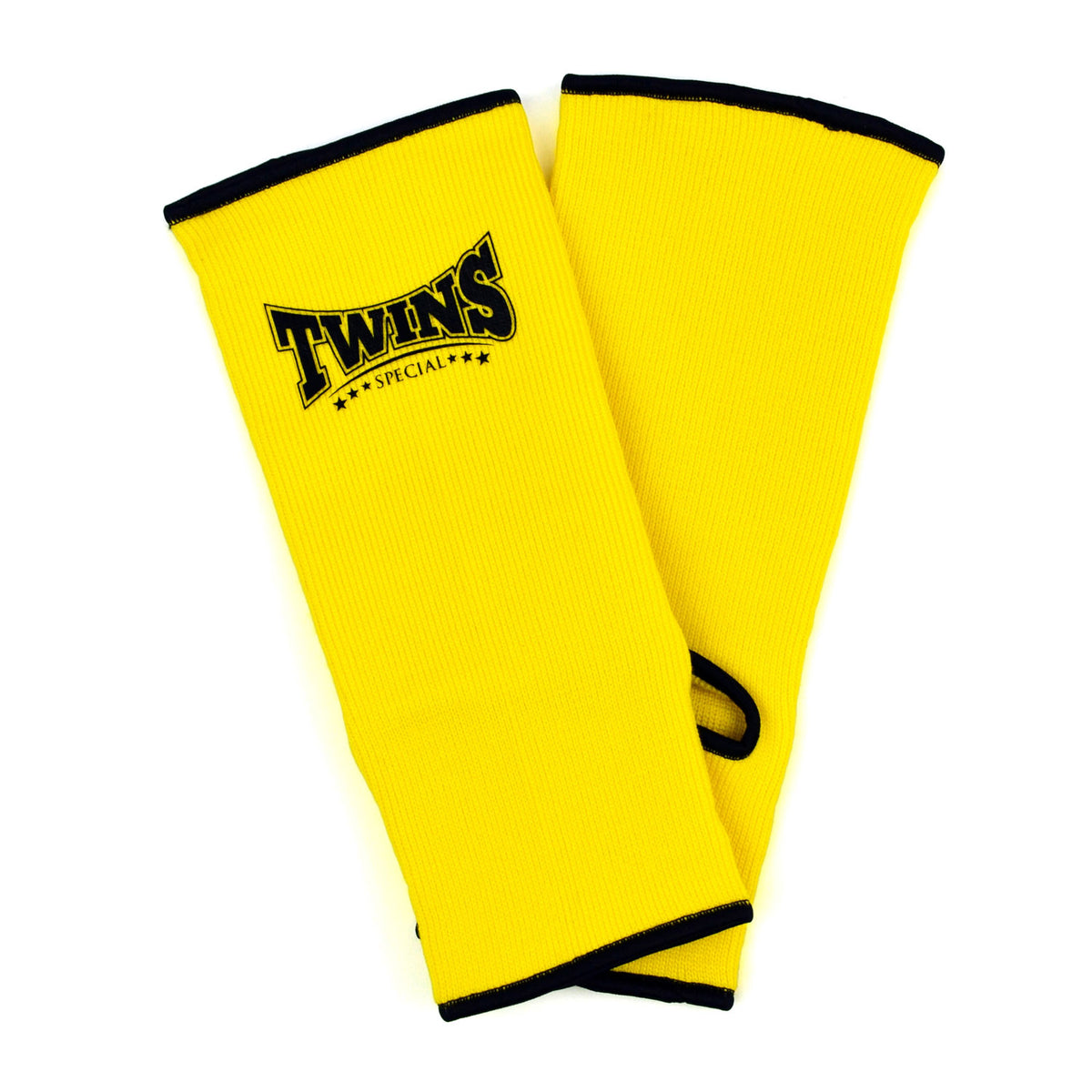 Yellow ankle guards with black trim and Twins Special logo on a white background