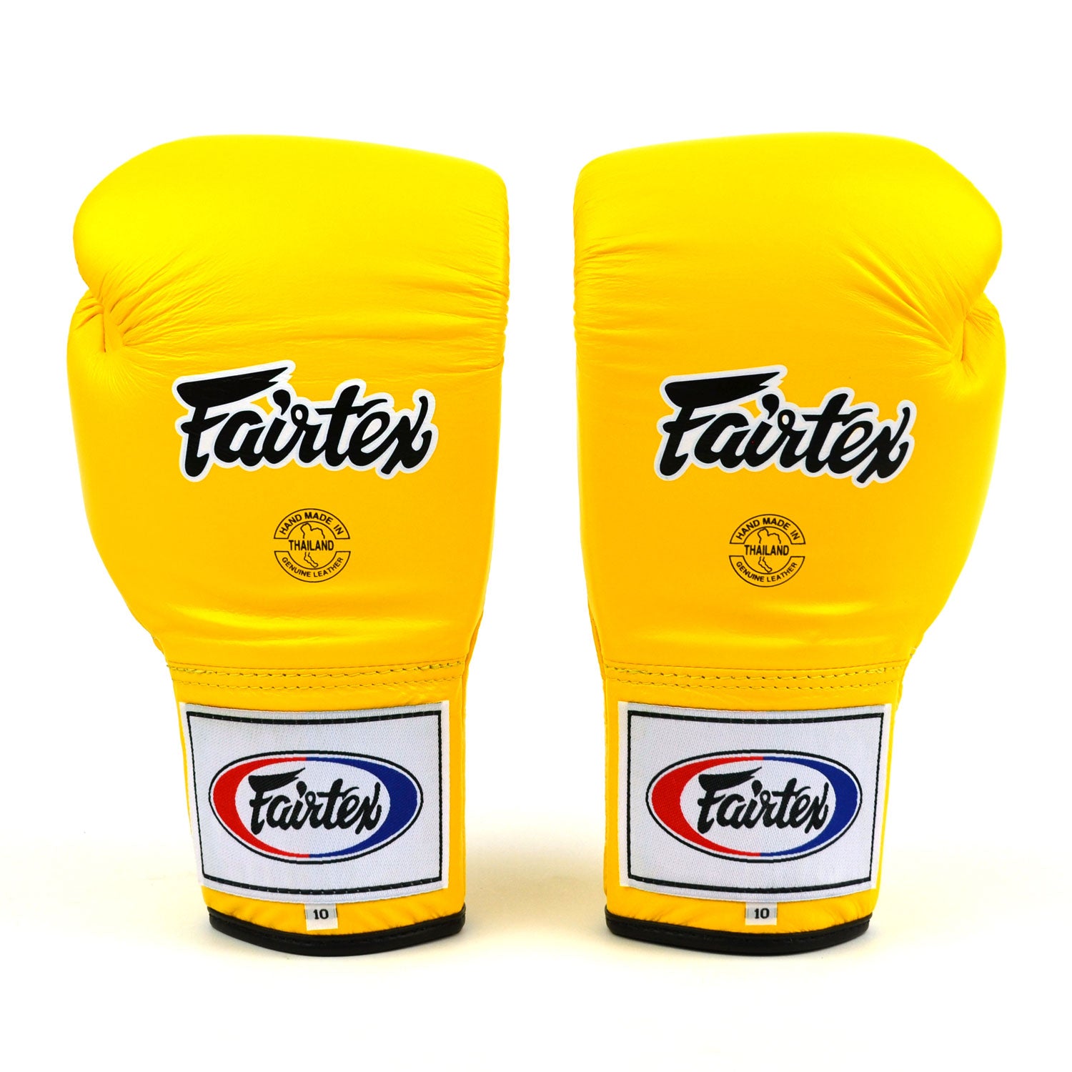 Pair of yellow Fairtex boxing gloves on a white background
