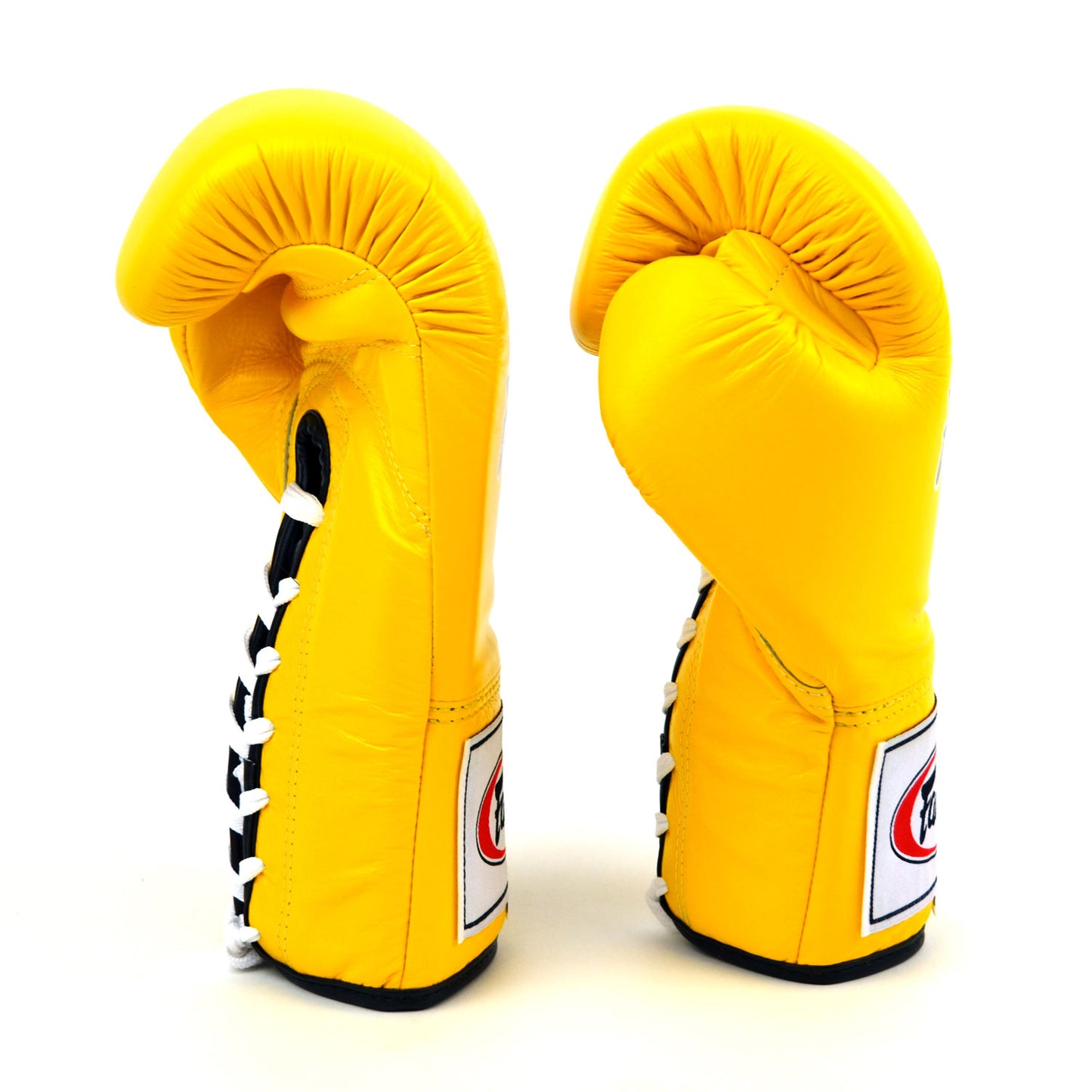 Pair of yellow boxing gloves with brand logos on a white background