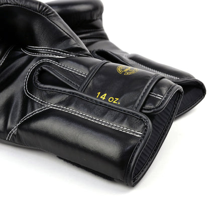 Black boxing gloves with gold 'Fairtex' branding on a white background