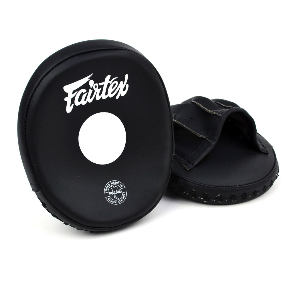 Black Fairtex boxing mitts on a white background