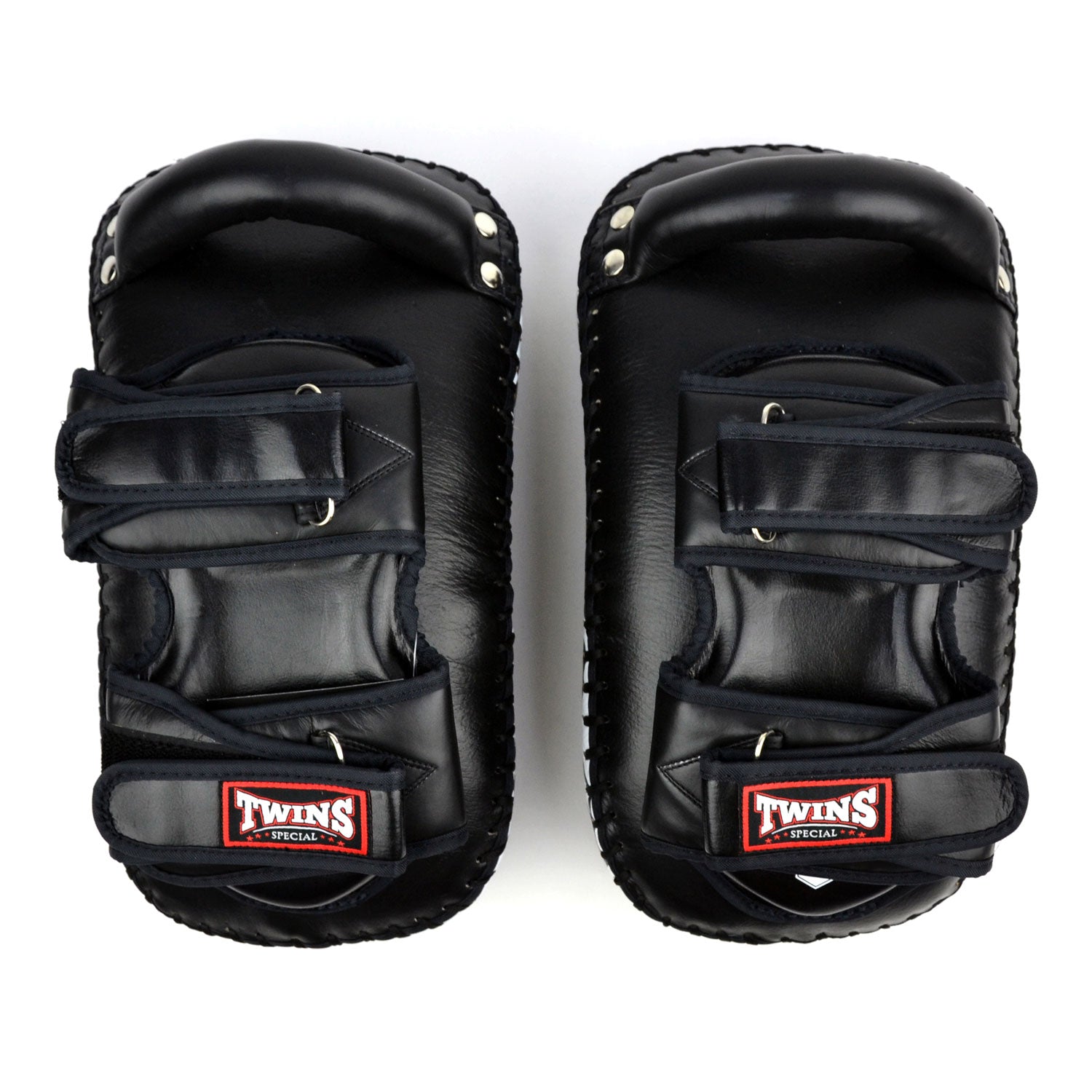 Pair of black Twins Special kick pads on a white background