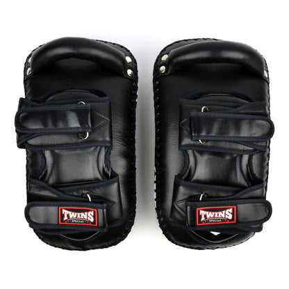 Pair of black Twins Special kick pads on a white background