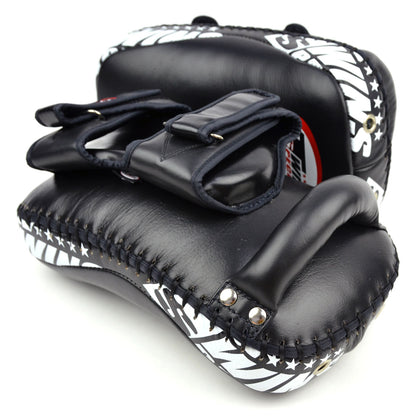 Black and white kick pads with star pattern on a white background