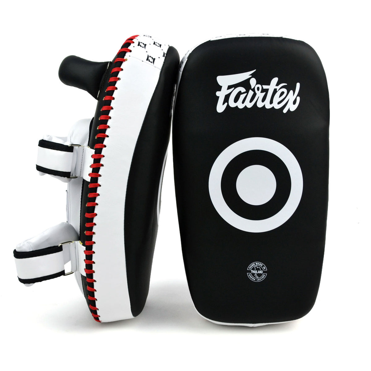 Black and white Fairtex boxing pads with a target design on a white background