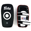 Fairtex kick pads with white and red accents on a white background