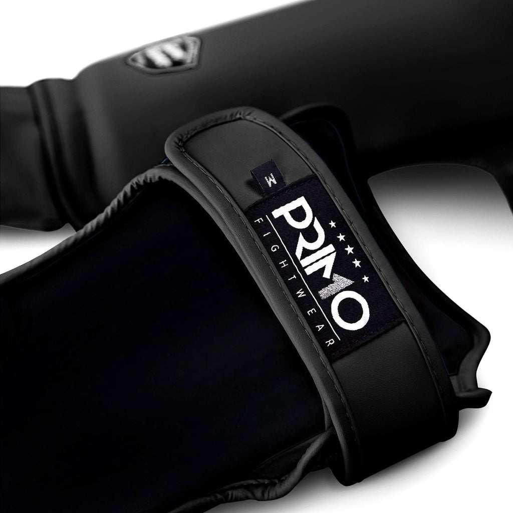 Black boxing glove with 'Primo Fightwear' logo on a white background