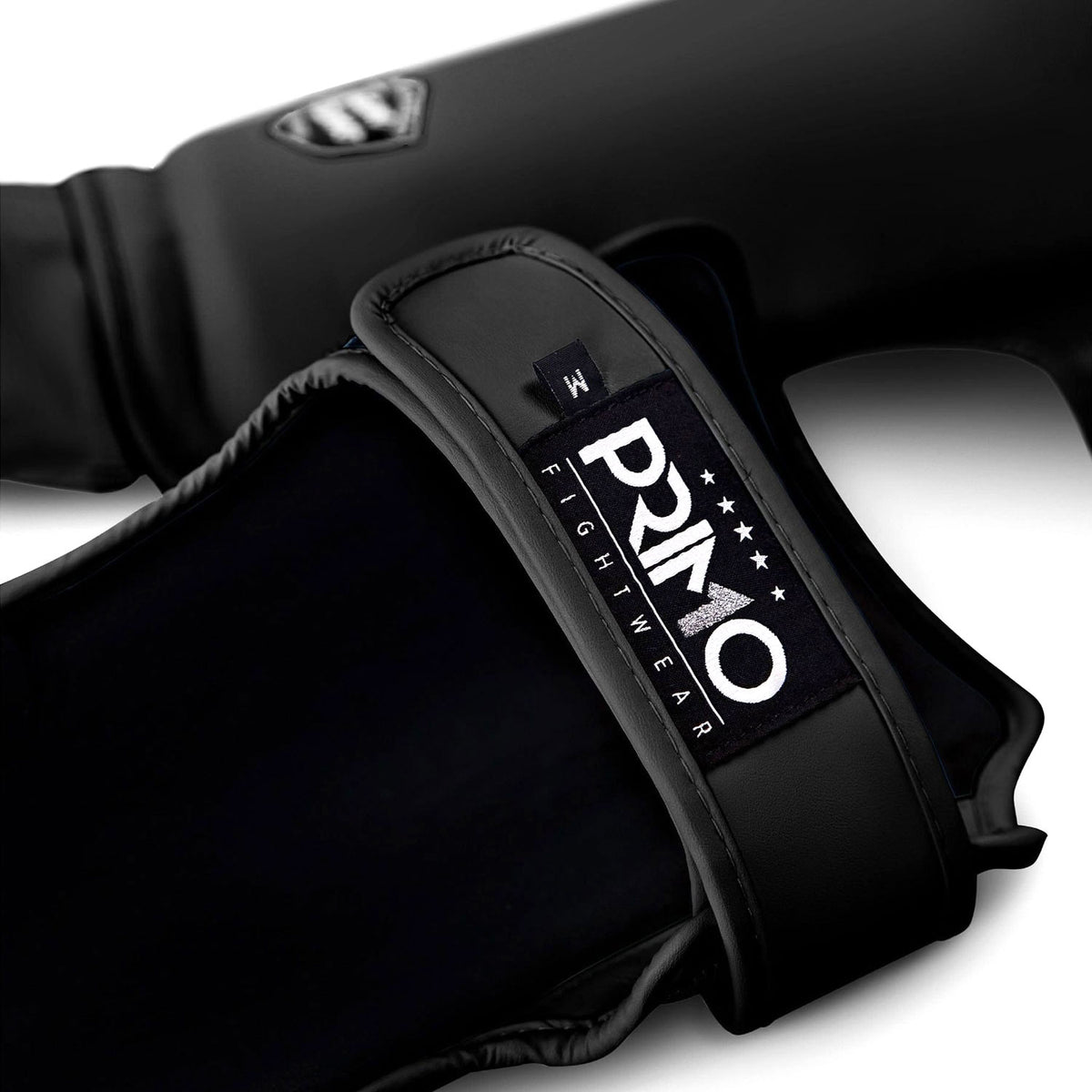 Black boxing glove with 'Primo Fightwear' logo on a white background