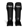 Black shin guards with 'Primo' branding on a light gray background