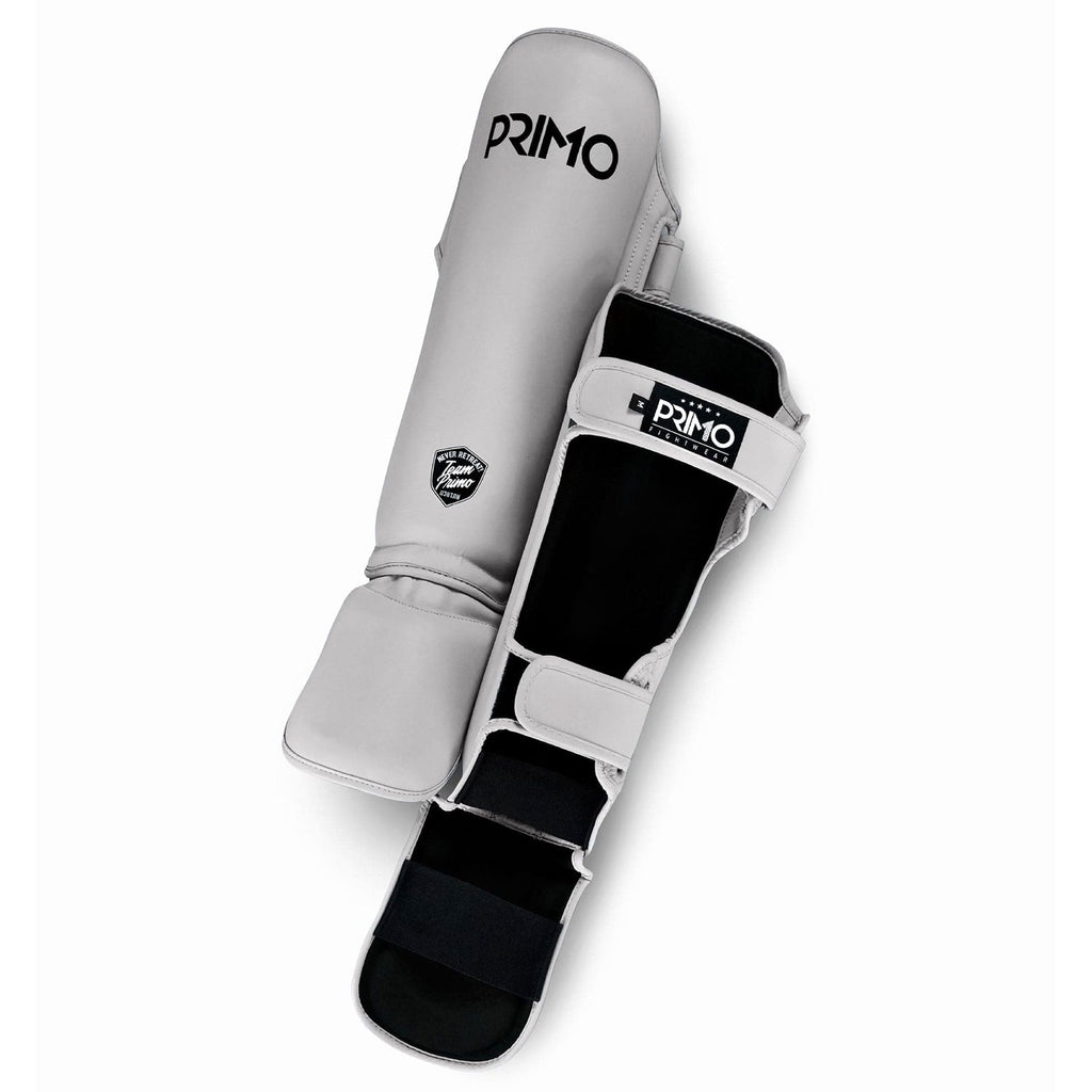 White shin guard with black accents and 'Primo' branding on a white background