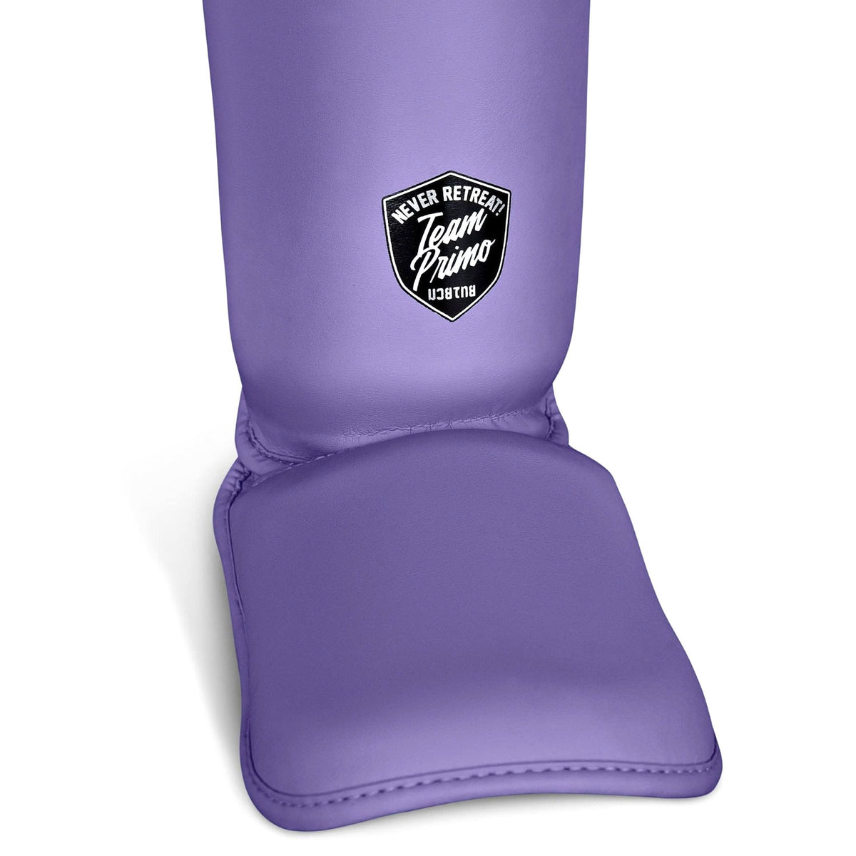 Purple shin guard with 'Team Prime' logo on a white background