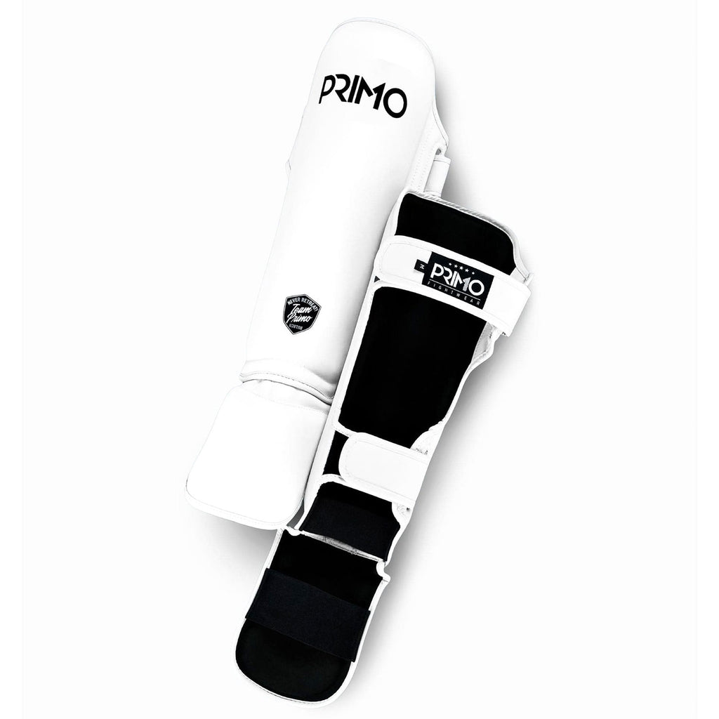 White and black shin guard with 'Primo' branding on a white background