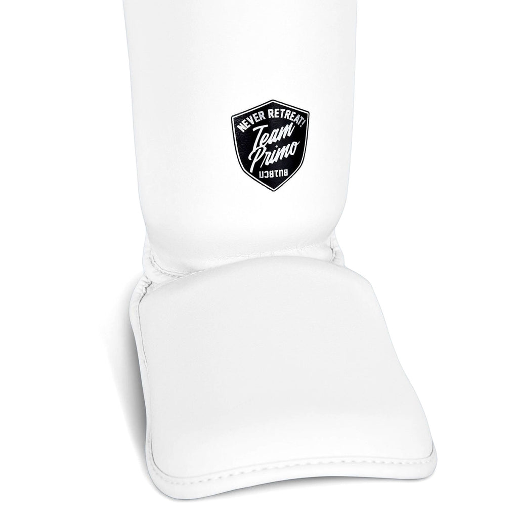 White shin guard with a black logo on a white background