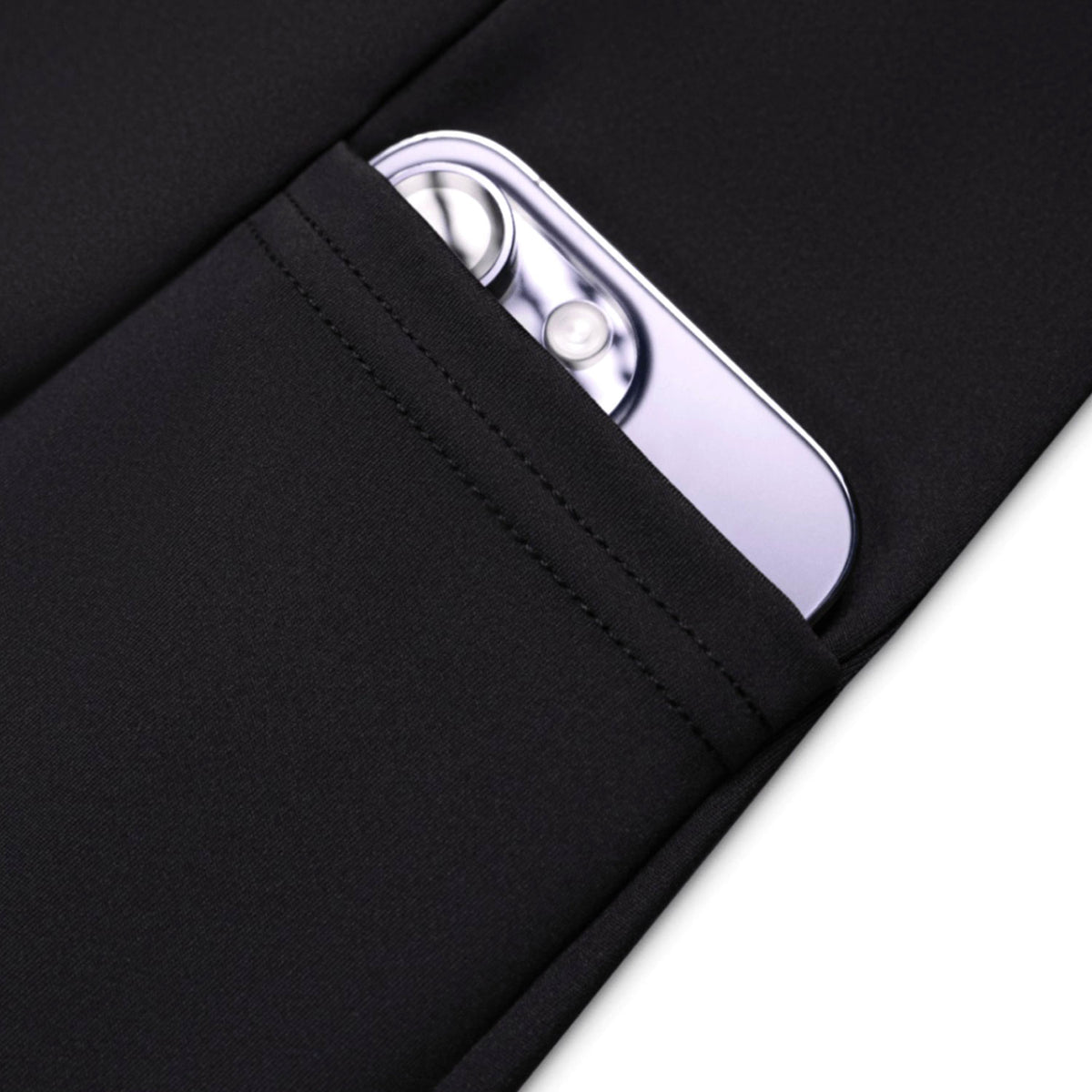 Black jacket pocket with a silver phone inside on a white background