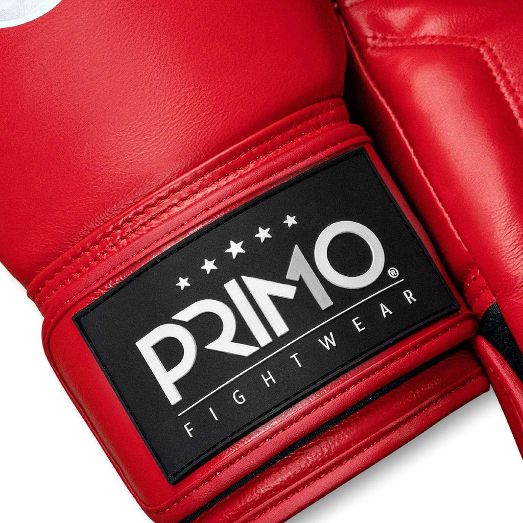 Red boxing glove with a Primo Fight Wear logo on a white background