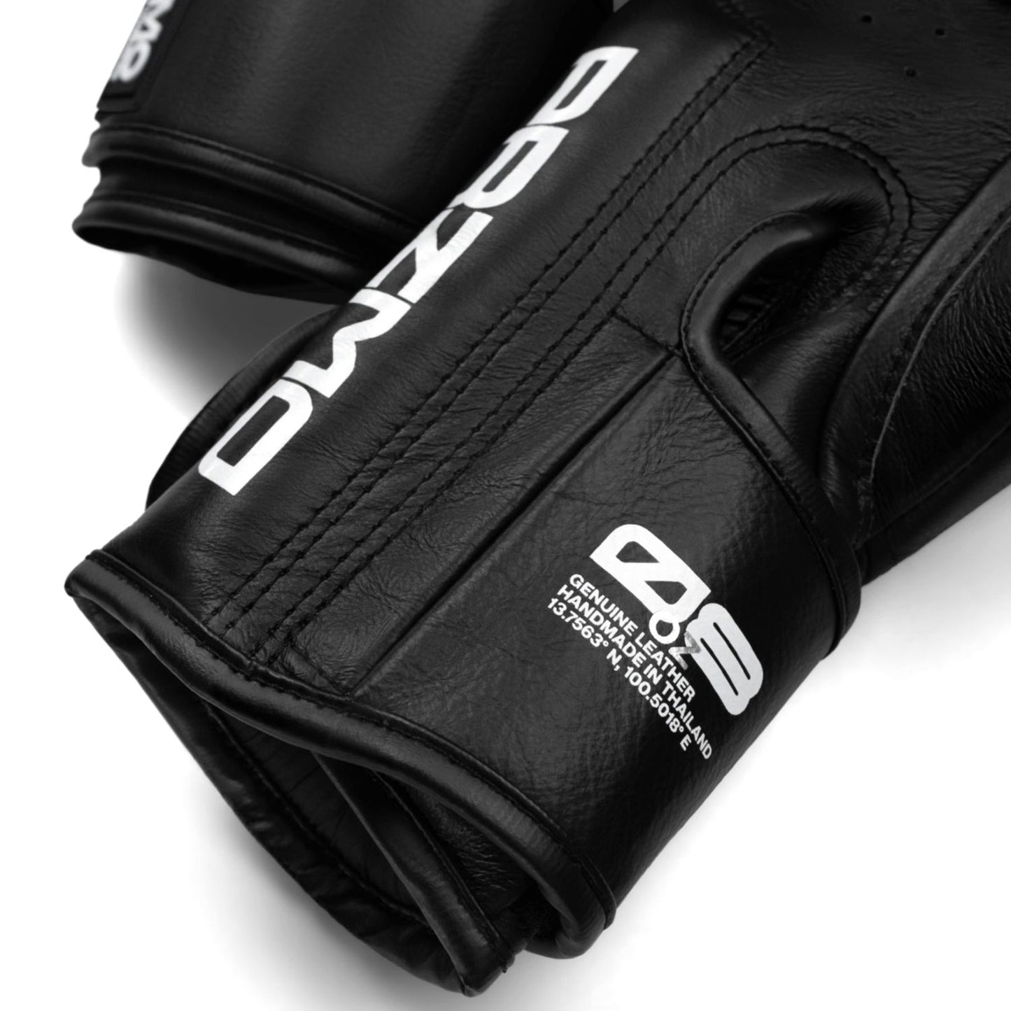 Black gloves with branding on a white background