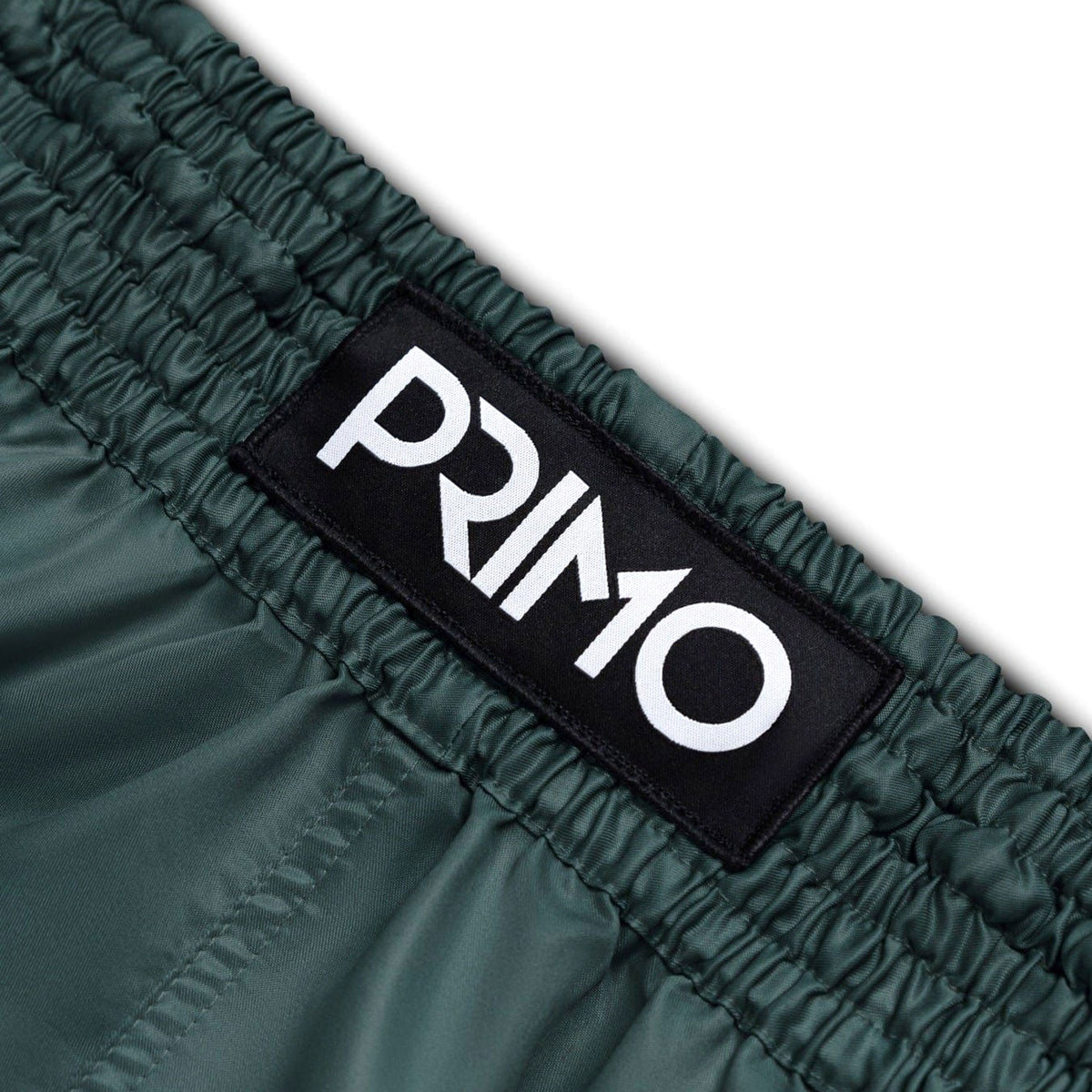 Green fabric with a 'Primo' logo patch on a white background