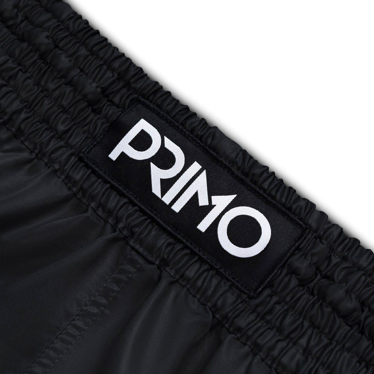 Black shorts with 'Primo' logo on a white background