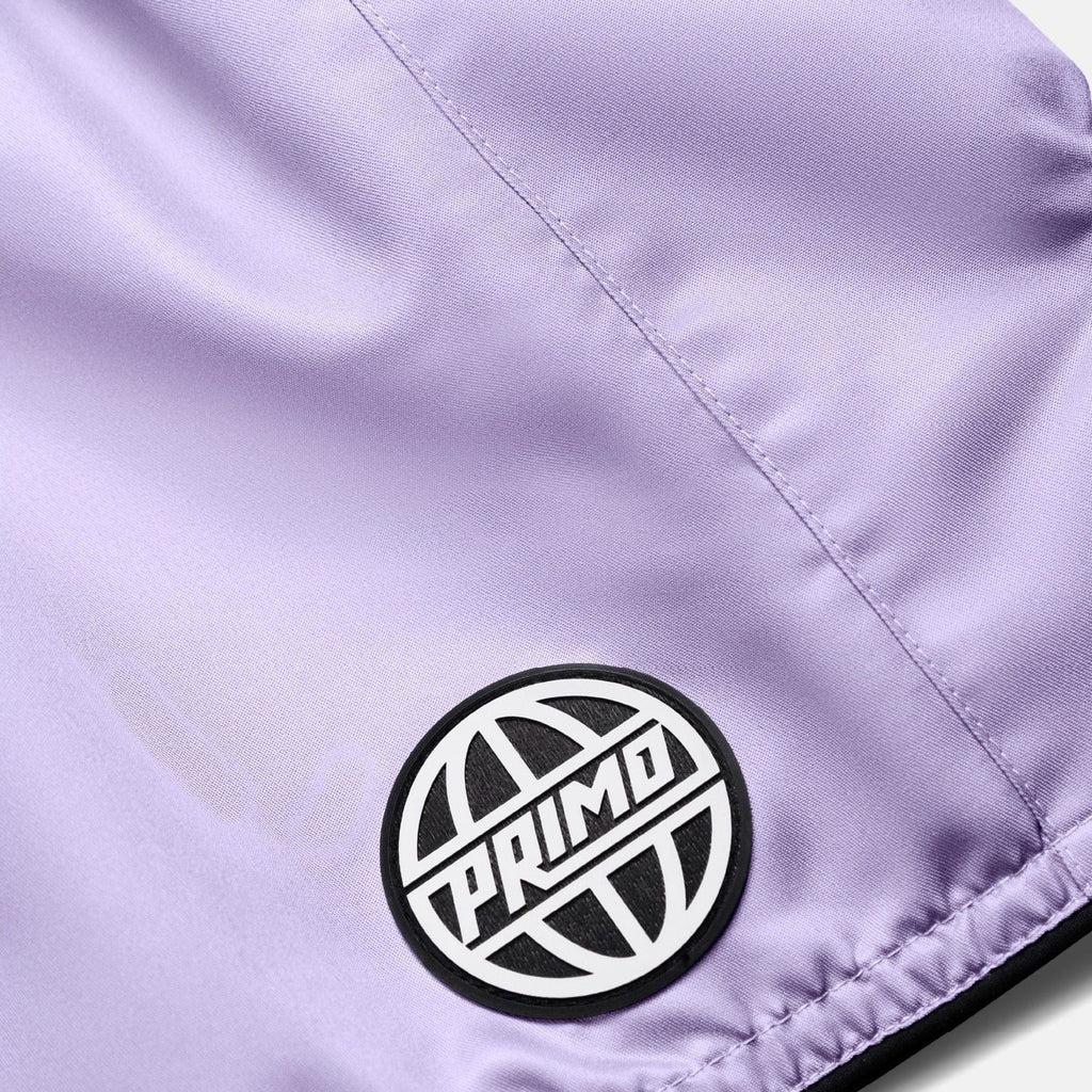 Close-up of a purple jacket with a 'Primo' logo patch.