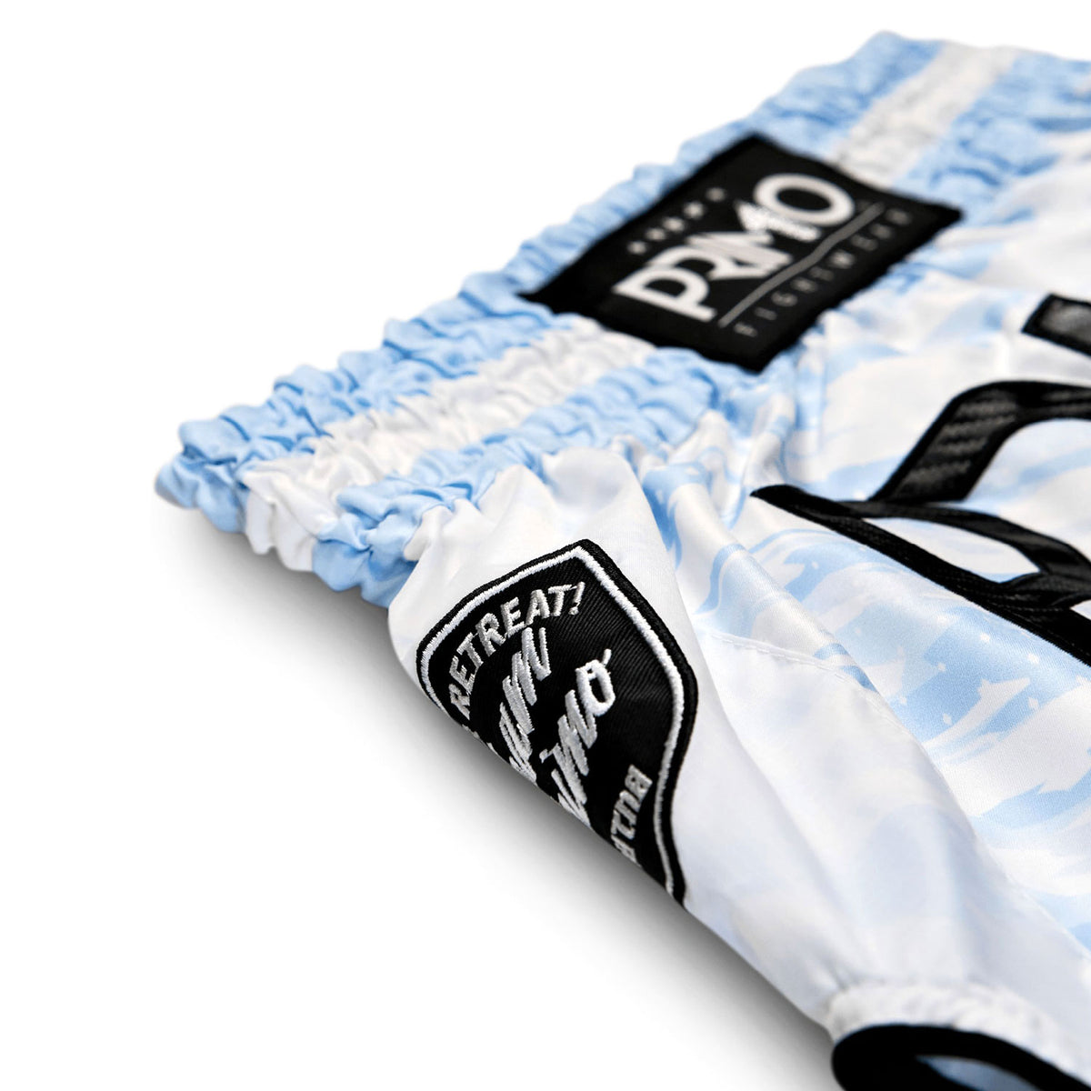 Close-up of a folded towel with 'Pomo' branding on a white background
