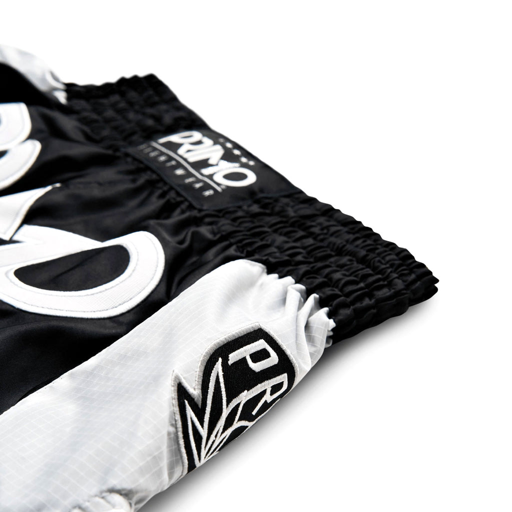 Black and white boxing shorts with 'PRO' branding on a white background