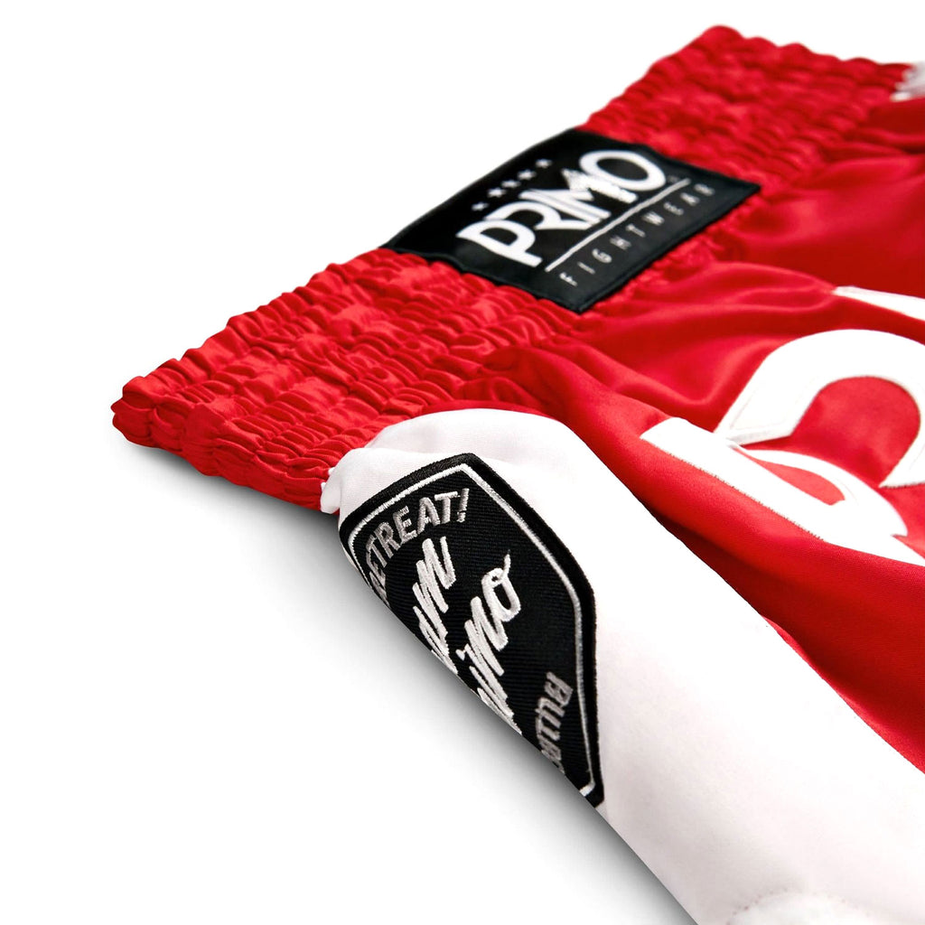 Red boxing shorts with white waistband featuring 'Promo' branding on a white background.