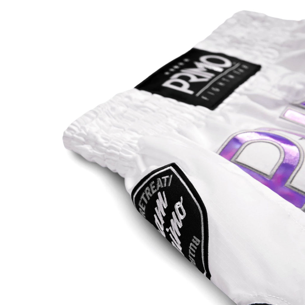 White socks with black and purple branding on a white background
