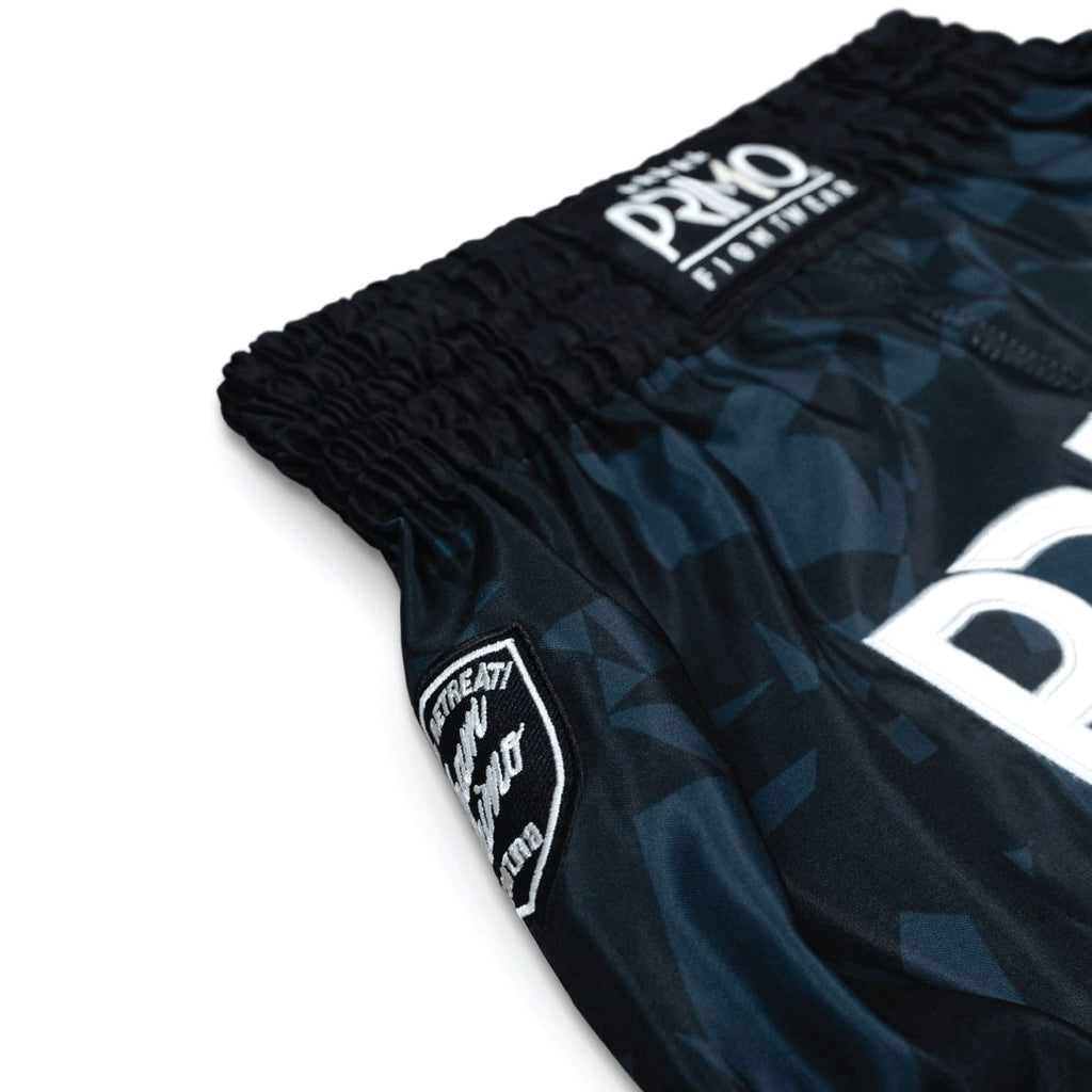 Black and blue athletic shorts with brand logo on a white background