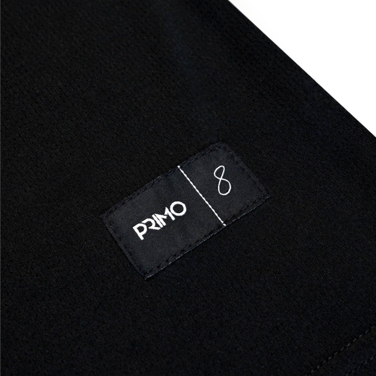 Black fabric with a 'Primo' label on a white background