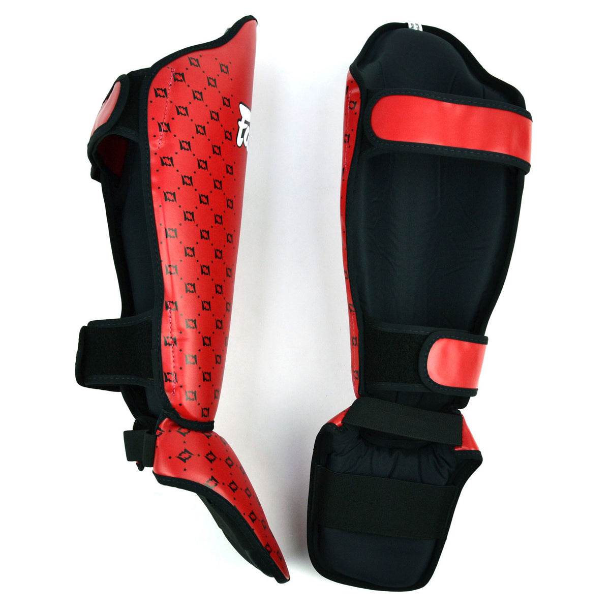 Red shin guards with 'Fairtex' branding on a white background