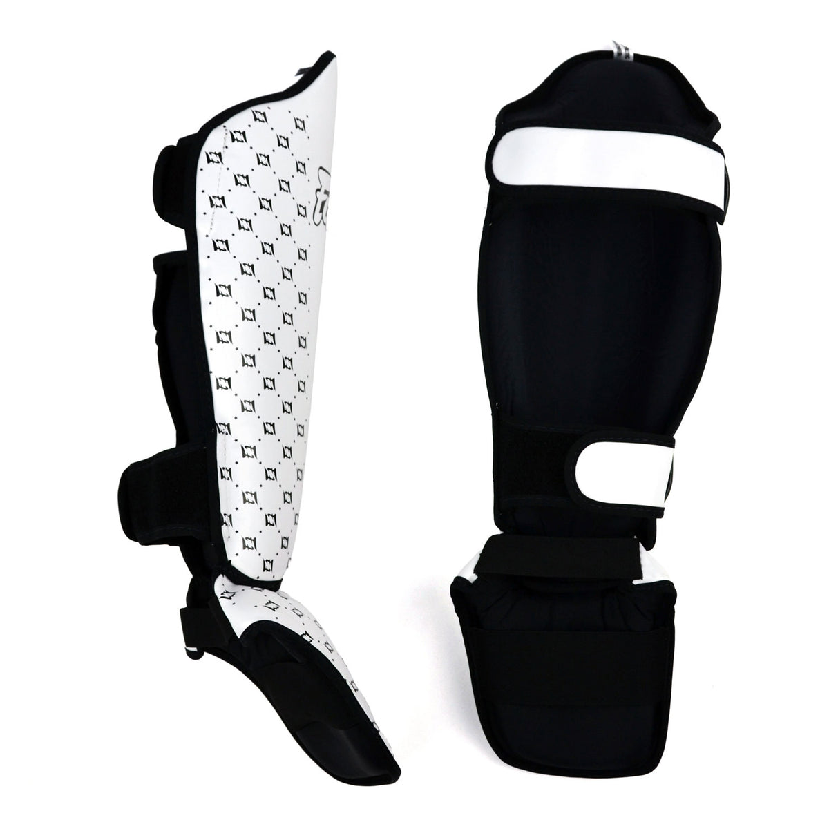 Pair of white shin guards with black patterns and 'Fairtex' branding on a white background