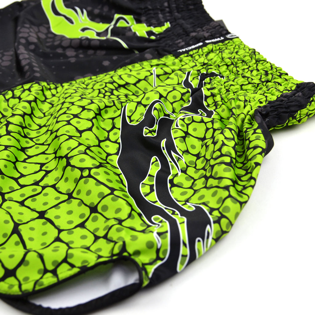 Green and black patterned shorts with 'Twins Special' branding on a white background