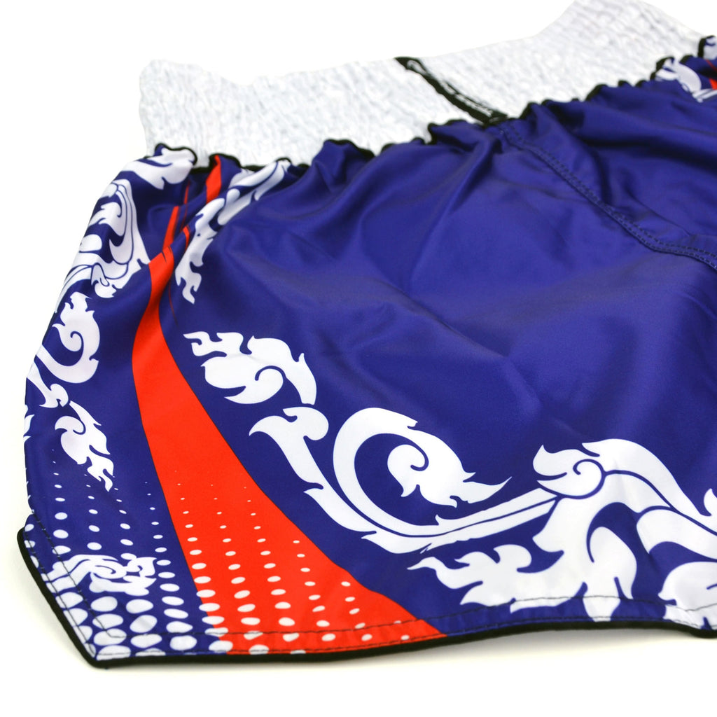 Blue and white Muay Thai shorts with red accents and Twins Special logo on a white background
