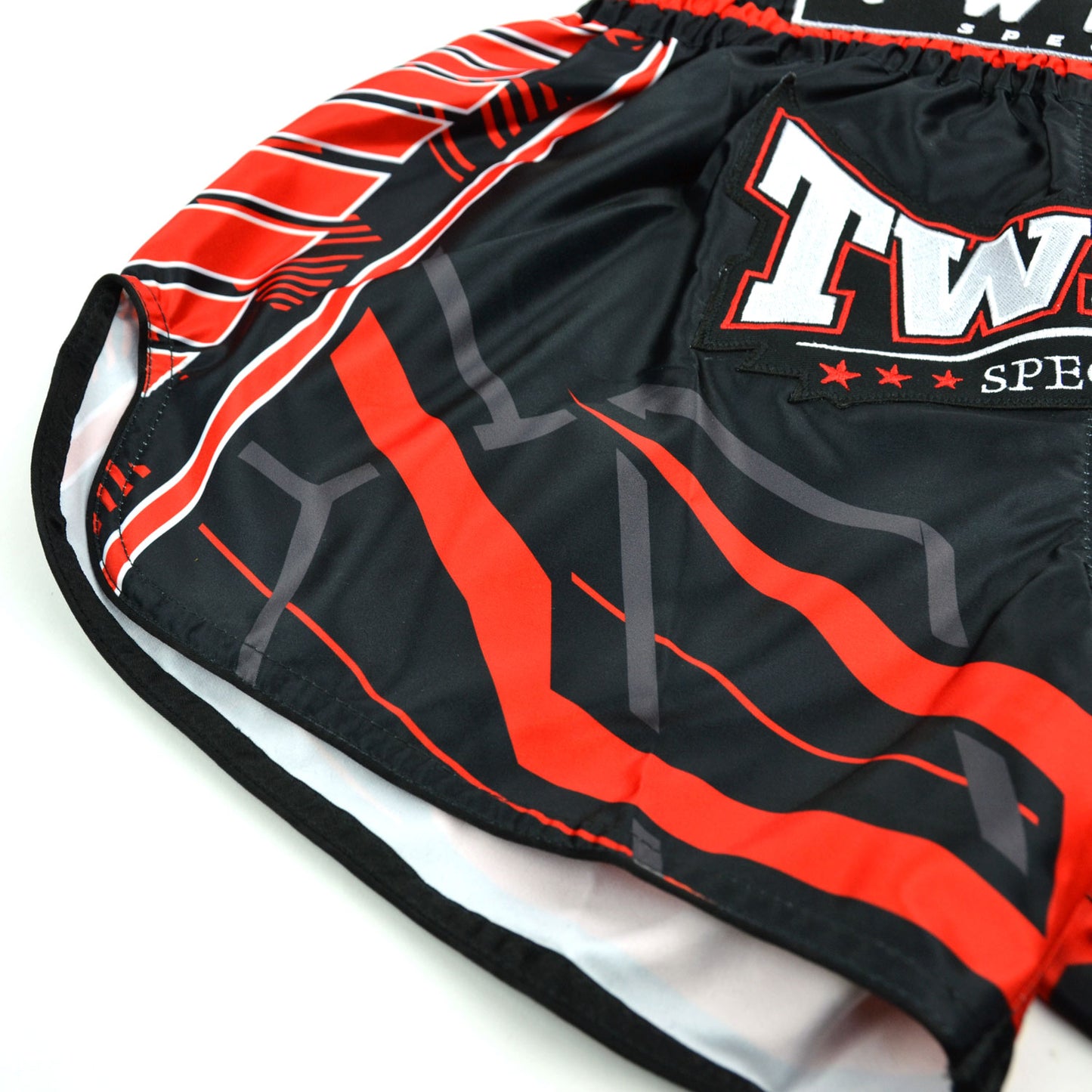 Black and red Twins Special boxing shorts on a white background