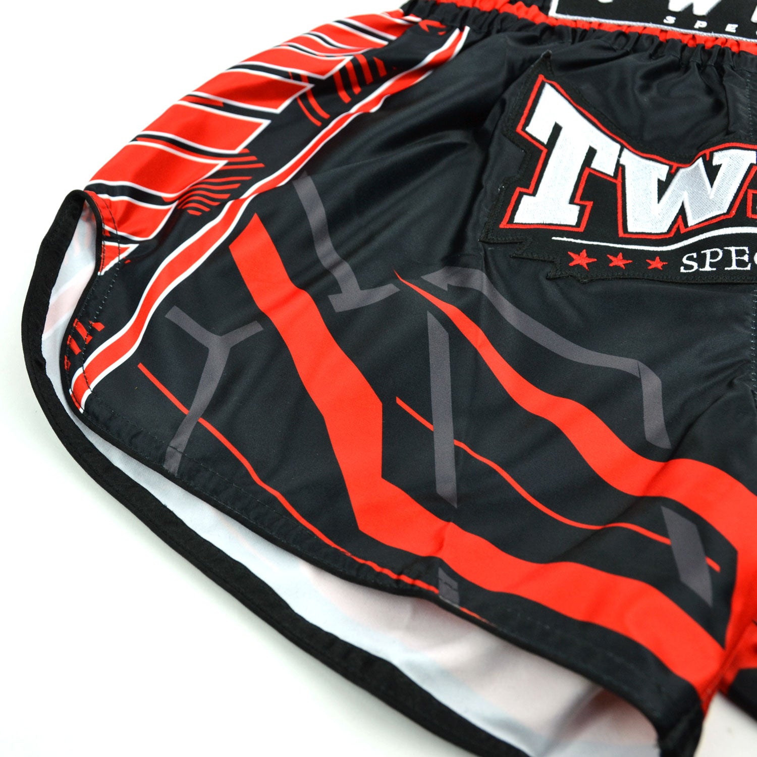 Black and red Twins Special boxing shorts on a white background