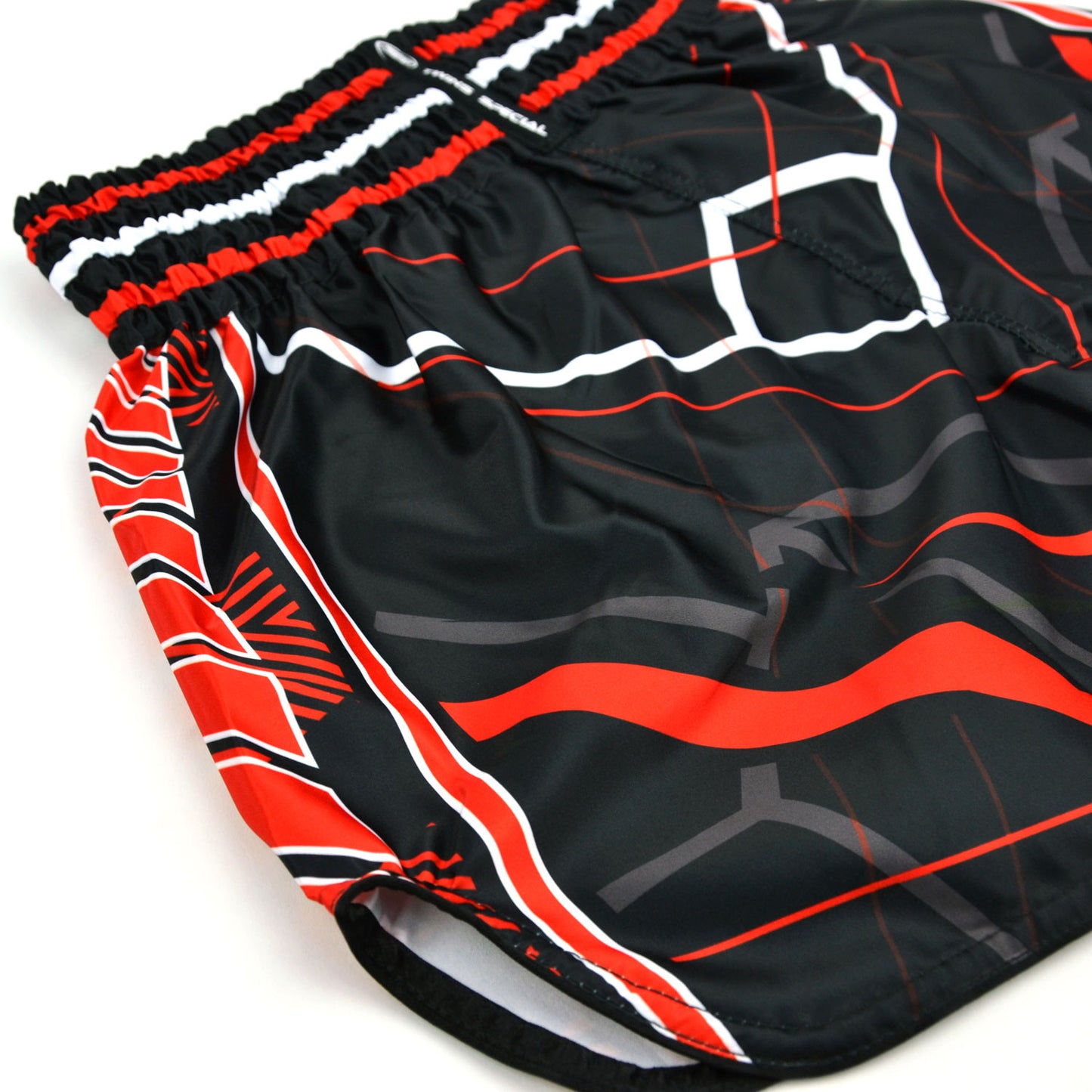 Black and red Twins Special boxing shorts on a white background