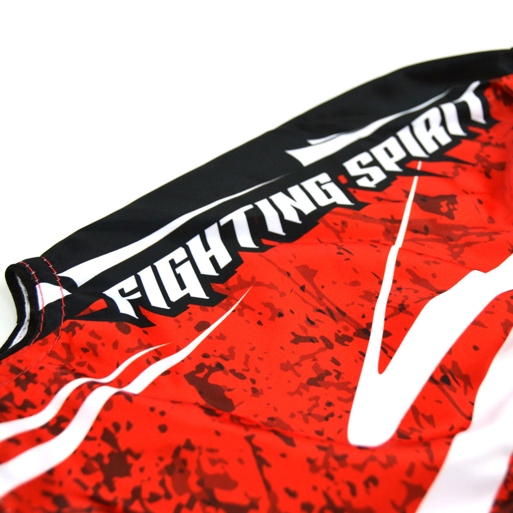 Red and black Twins Special boxing shorts on a white background