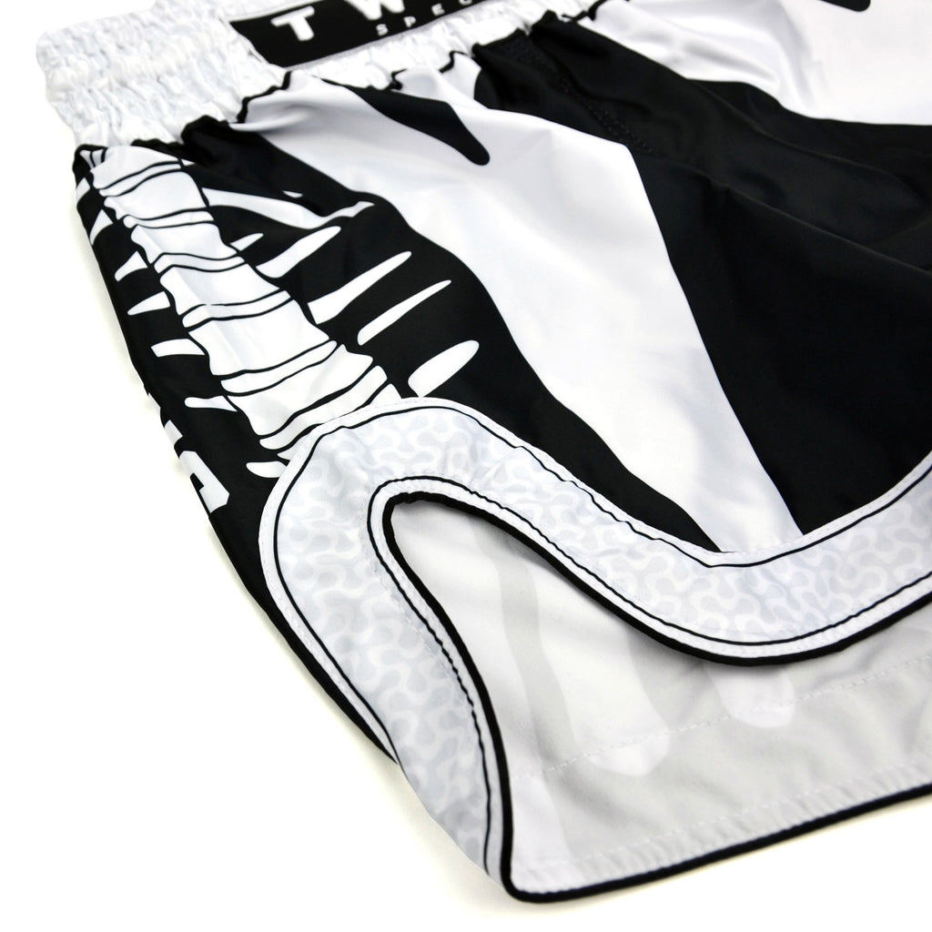Black and white boxing shorts with 'Twins Special' branding on a white background