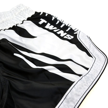 Black and white boxing shorts with 'Twins Special' branding on a white background
