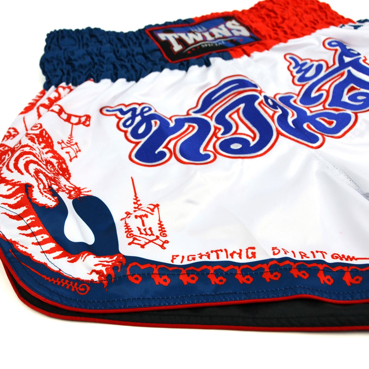 White boxing shorts with red and blue accents featuring Twins Special branding on a white background.